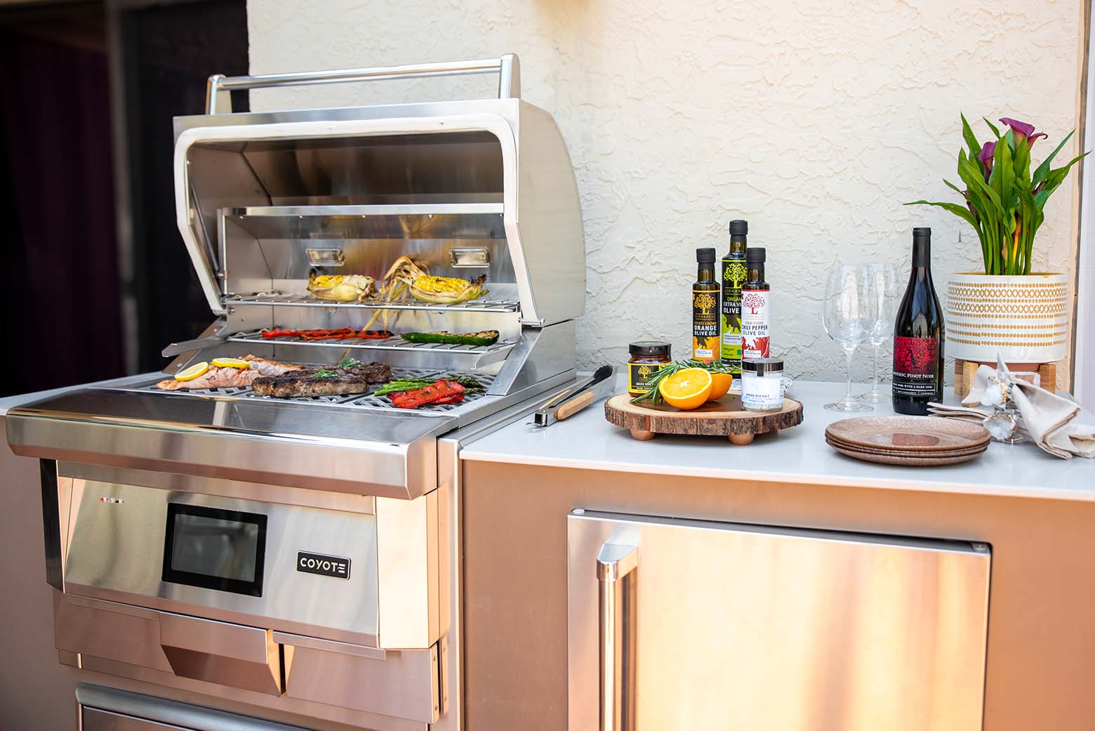 small modular outdoor kitchen with 28 inch coyote pellet grill