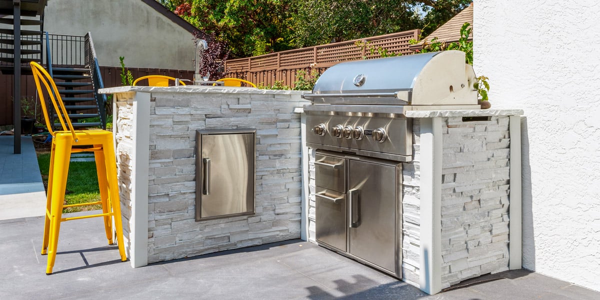 small patio kitchen design with yellow bar chair