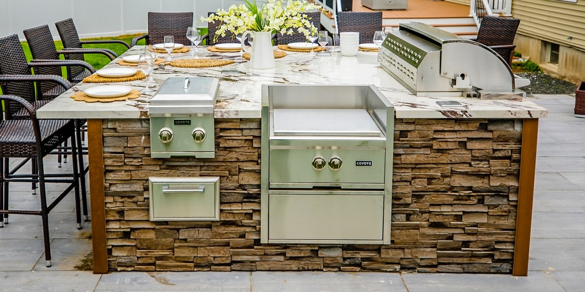 square stack stone outdoor kitchen in brown