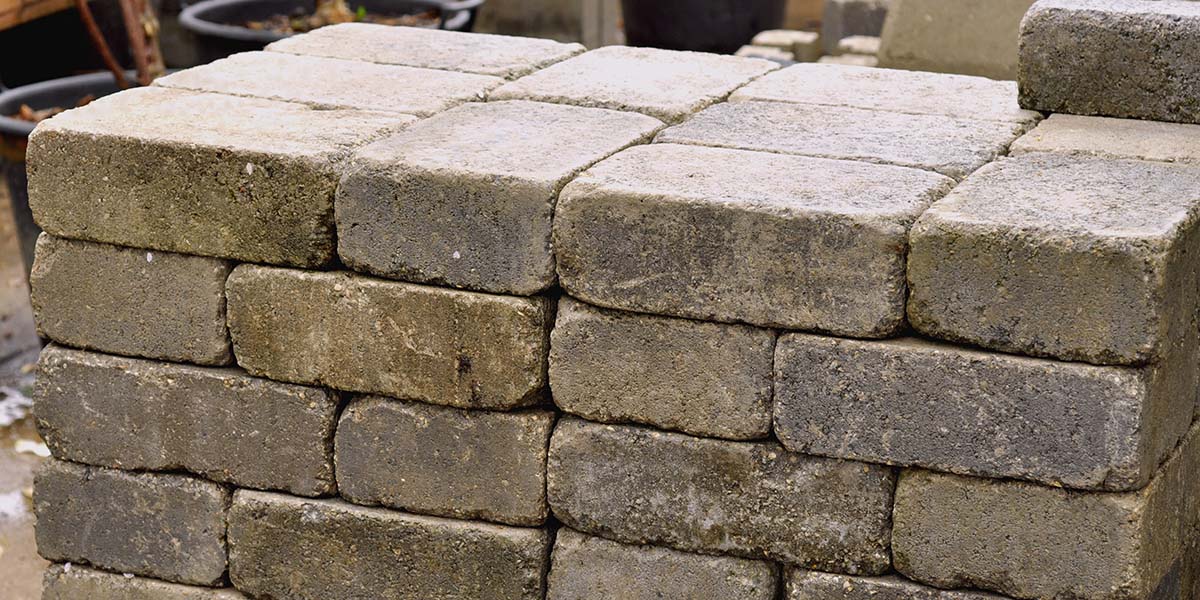 stack of paver bricks ready to be used for outdoor kitchen patio surface