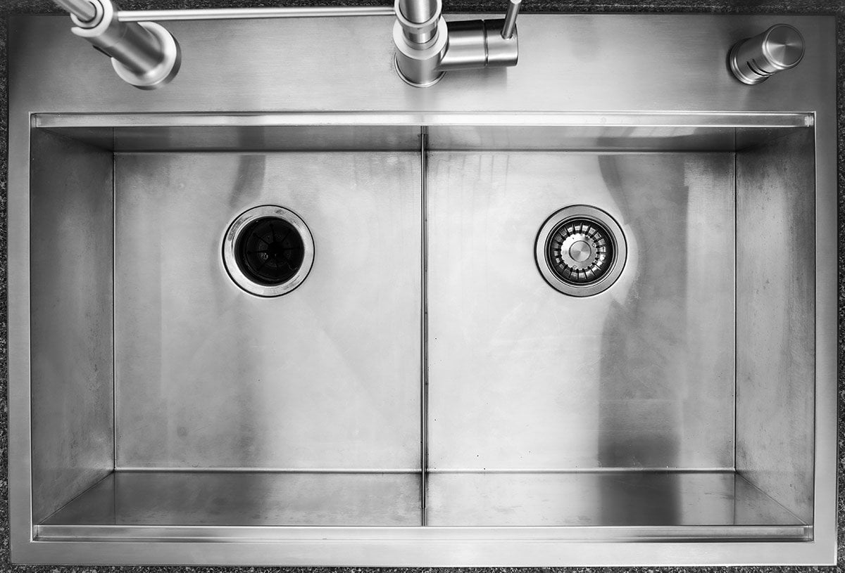 Large double bowled sinks built into outdoor kitchen
