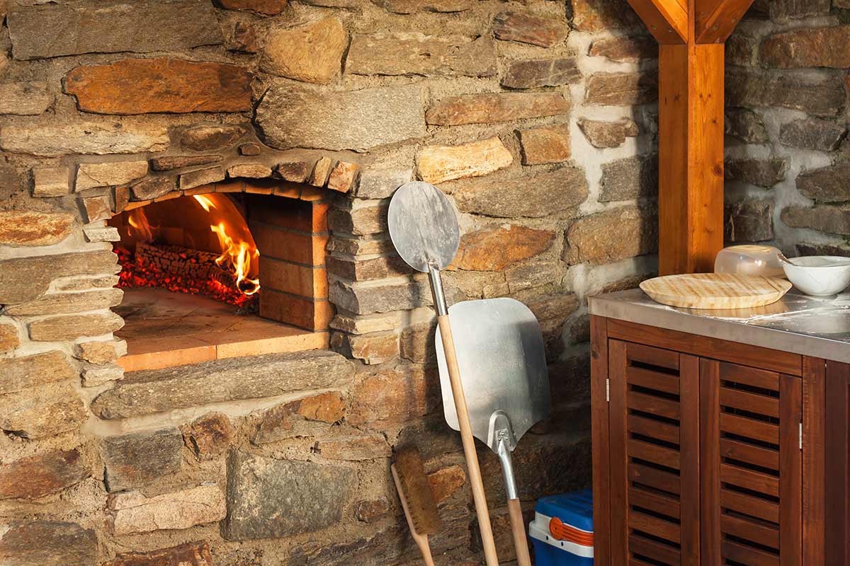 stone pizza oven built into wall