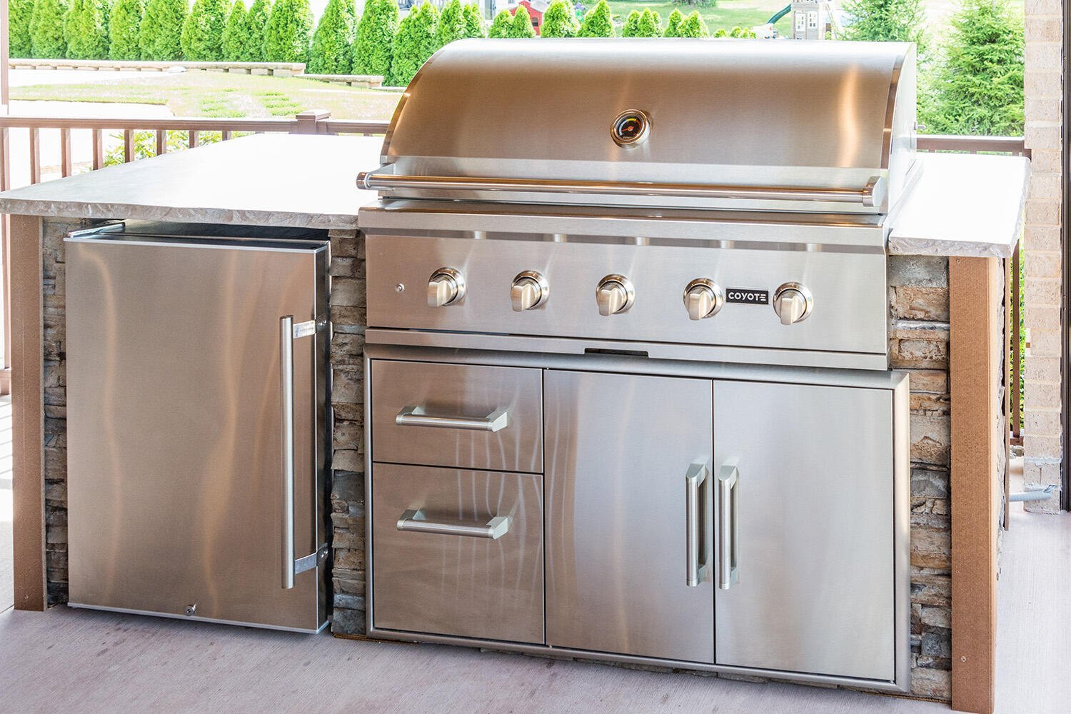 straight outdoor kitchen island with combo storage on deck