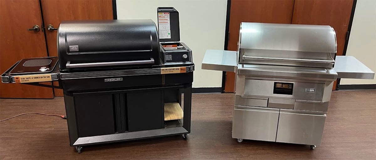 traeger cart next to coyote pellet grill cart
