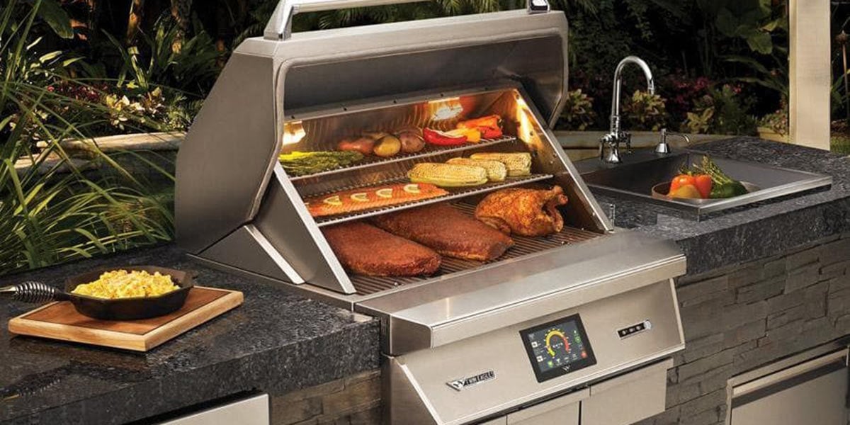 Twin Eagles built in pellet grill in outdoor kitchen grilling food
