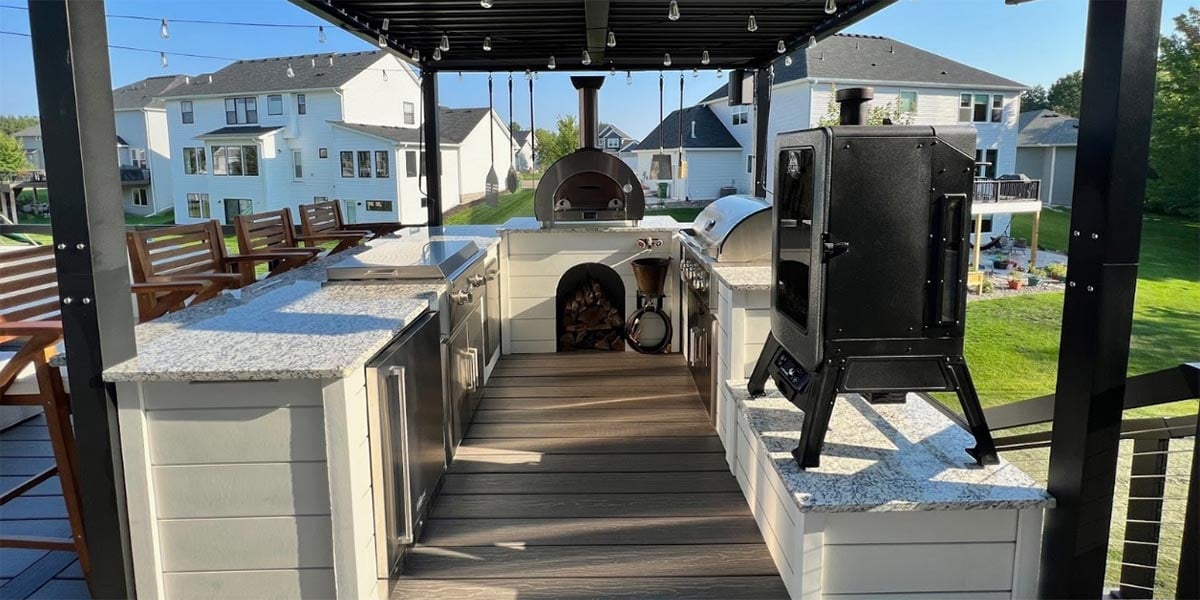bar island on u shape outdoor kitchen on deck