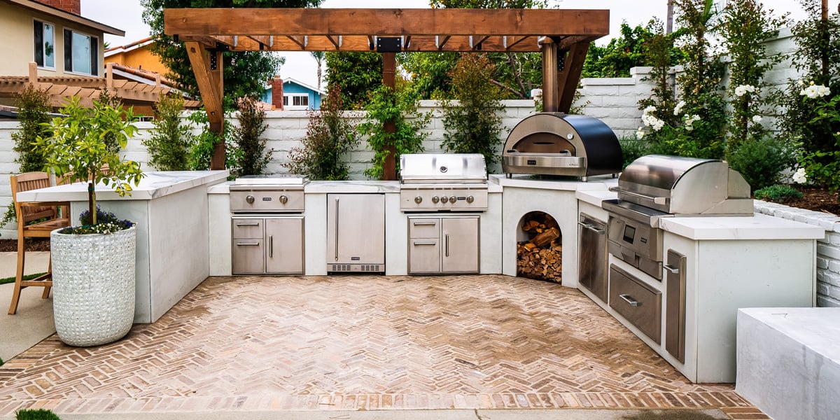 u shaped bbq island on brick patio