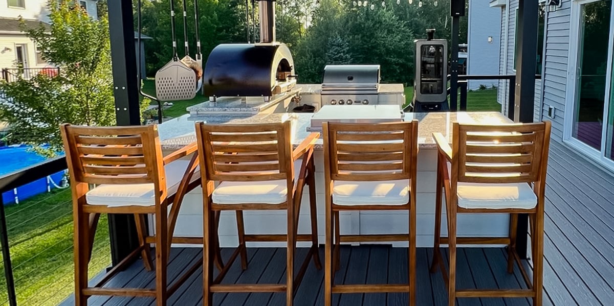 u shaped outdoor kitchen with bar chair seating