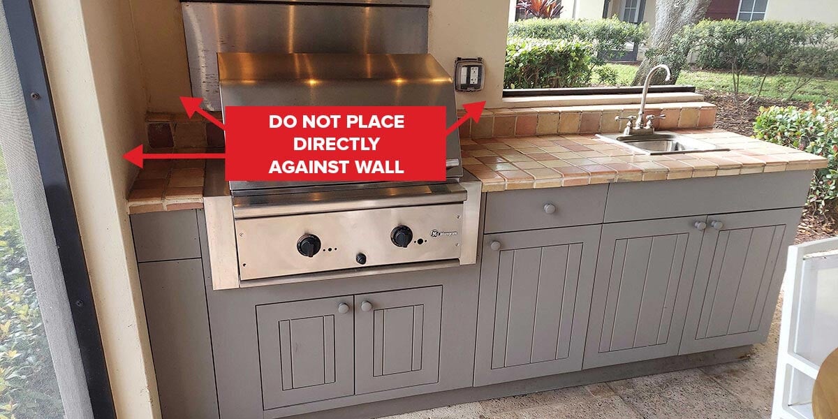 unsafe outdoor kitchen placed directly on wall