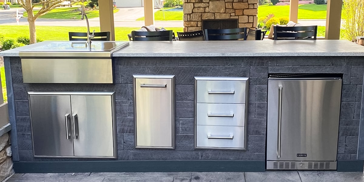 weathered wood patio island with refreshment center and refrigerator