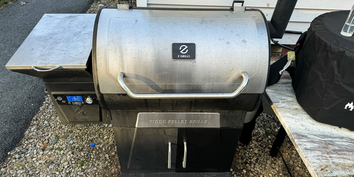 z grills 700d3 pellet smoker outside on gravel