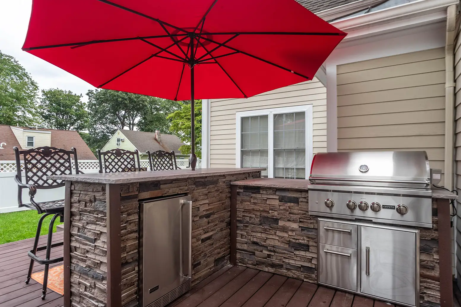 outdoor bar kitchen on deck with umbrella