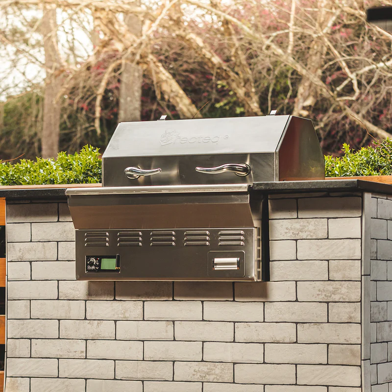 recteq pellet grill built into brick outdoor kitchen structure